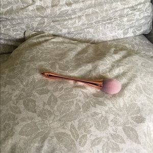 Rose-gold synthetic makeup brush